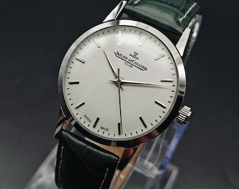 Orologio Jaeger-LeCoultre Club vintage anni '70: quadrante bianco, carica manuale, cinturino in pelle verde in condizioni quasi perfette.