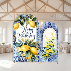 May include: Two arched backdrop covers featuring a blue and white Mediterranean tile pattern. The larger cover displays yellow lemons, green leaves, and the text Happy Birthday. The smaller cover features a window graphic with yellow lemon branches.