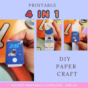 May include: A printable DIY paper craft project featuring a 4-in-1 design. The images show a blue paper watch with an astronaut graphic, a digital clock display reading 3:25, and a small rocket icon. The craft is formatted for A4 paper size.