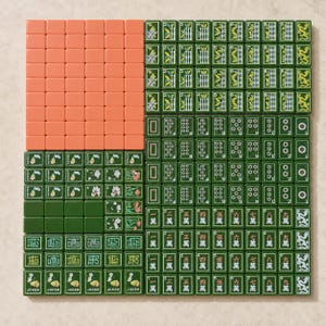 May include: A complete set of Mahjong tiles arranged in a grid. The set includes solid orange tiles, green tiles with bamboo patterns, circular dot designs, Chinese character tiles, dragon tiles, flower tiles, and tiles labeled with the word Joker.