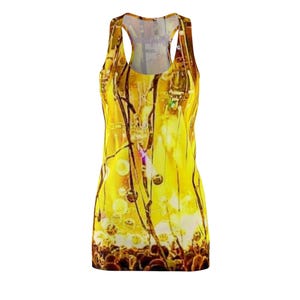 May include: A sleeveless dress with a vibrant yellow and brown abstract design. The dress features a scoop neck and a fitted silhouette. The pattern includes organic shapes and a variety of textures, creating a unique and eye-catching look.
