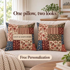 May include: Two square throw pillows featuring a patchwork design with floral and striped patterns in red, blue, cream, and green. One pillow displays the text LUCY & SAM'S HOME in a rectangular frame. The pillows are placed on a light-colored sofa.