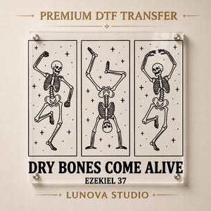 May include: A clear rectangular sheet featuring three vertical panels with black line art of dancing skeletons against a starry background. The text reads PREMIUM DTF TRANSFER, DRY BONES COME ALIVE, EZEKIEL 37, and LUNOVA STUDIO in black lettering.