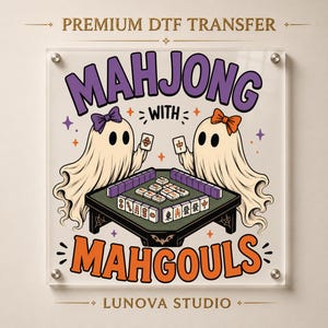 May include: A premium DTF transfer featuring two ghosts playing mahjong at a table. The text reads "MAHJONG WITH MAHGOULS" and "LUNOVA STUDIO". The ghosts are wearing purple and orange bows, surrounded by small stars and spiderweb accents.