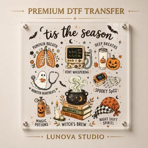 May include: A square DTF transfer sheet featuring the text 'tis the season' and 'LUNOVA STUDIO'. Illustrations include a pumpkin-shaped lung, a medical monitor, a pumpkin tumbler, a ghost with a stethoscope, a pulse oximeter, a cauldron on books, and a scrub cap.