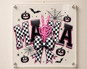May include: A DTF transfer design featuring the word MAMA in black and white checkered letters with pink outlines. A pink skeleton hand makes a peace sign, and a large checkered bow sits below. Includes black pumpkins, bats, and spiderwebs.