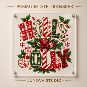 May include: A square DTF transfer featuring the text HOLLY JOLLY in festive patterns including red and white stripes, green and white knit designs, red polka dots, and red and black plaid, accented with holly leaves, berries, and ornaments.
