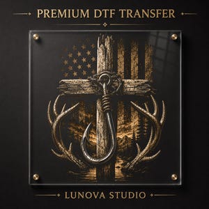 May include: A square Premium DTF Transfer from Lunova Studio featuring a graphic of a wooden cross, a large fishing hook, and deer antlers against a distressed American flag background. The design is displayed on a clear acrylic panel with gold hardware.
