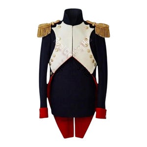 May include: A dark blue military-style tailcoat featuring a white chest panel with gold buttons, red cuffs, and red tail accents. The shoulders are adorned with gold fringed epaulettes. The text Royal Clothing Hub is visible across the chest.