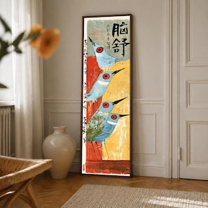 May include: A tall, rectangular framed wall art piece featuring a vertical composition of four stylized blue birds with prominent red eyes. The background is divided into red and yellow sections with black Chinese calligraphy text integrated.