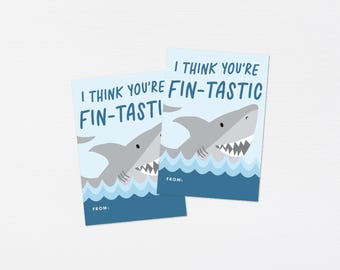 May include: Two blue and white cards with a shark illustration and the text "I think you're fin-tastic".