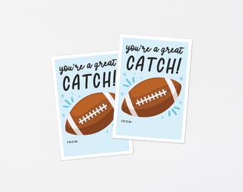May include: Two printable cards with a blue background and white text that says "You're a great catch!" with a cartoon football on each card.