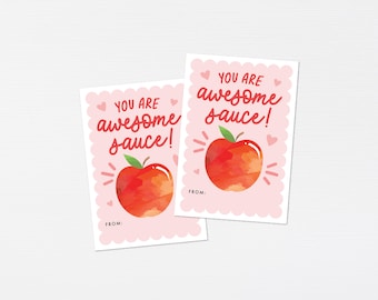 May include: Two pink cards with scalloped edges and white hearts. Each card has a red apple illustration and the text "You are awesome sauce!" in red. The cards are for teachers or students.