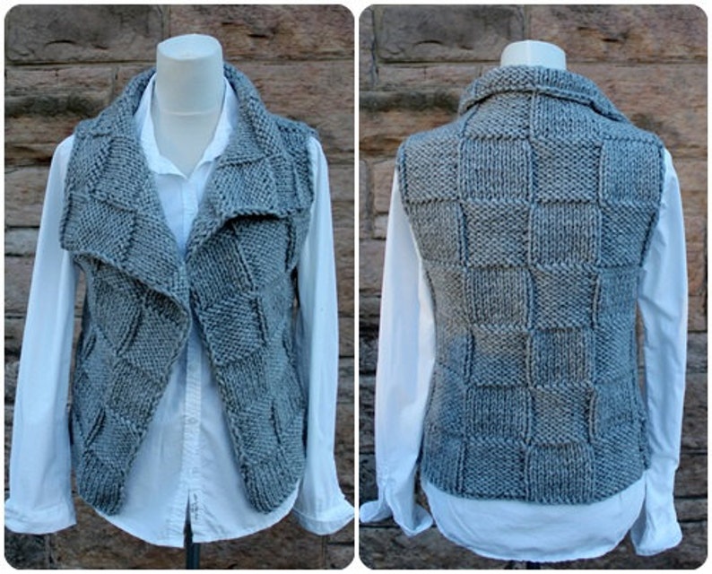 May include: A gray knitted vest with a square pattern on the back and a draped collar in the front.