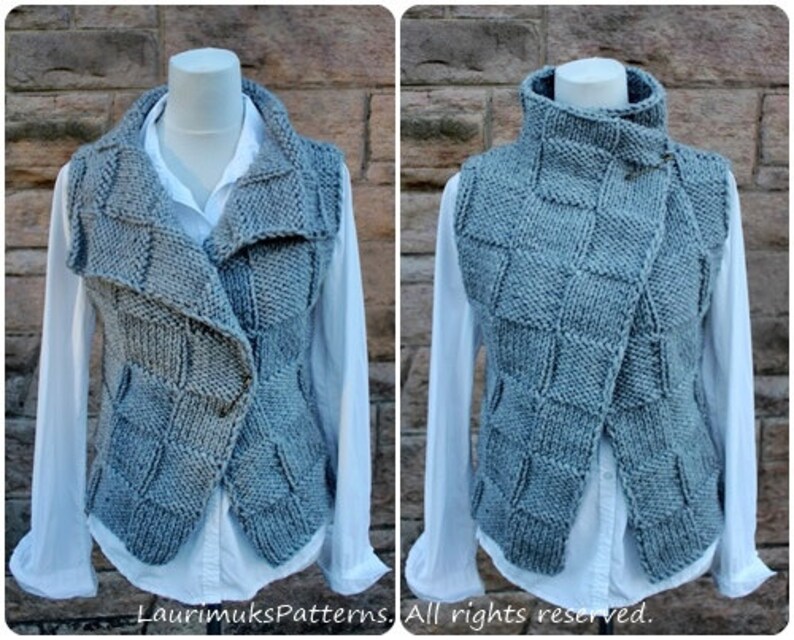 May include: A gray knitted vest with a high collar and a diagonal closure. The vest is made with a textured stitch pattern and has a relaxed fit.