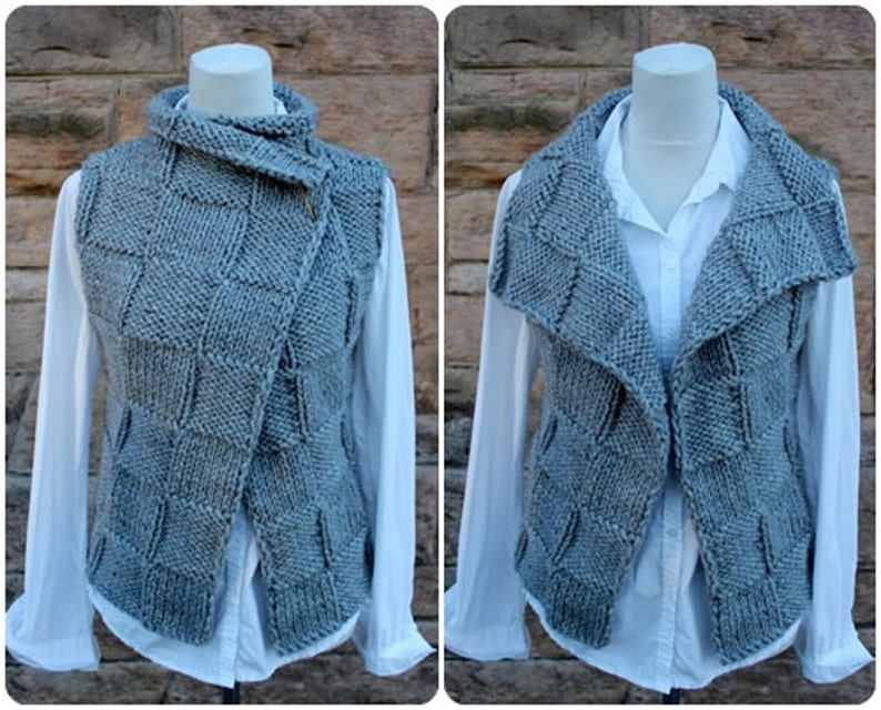 May include: A gray knitted vest with a large, folded collar. The vest has a zipper closure and a unique, textured pattern.
