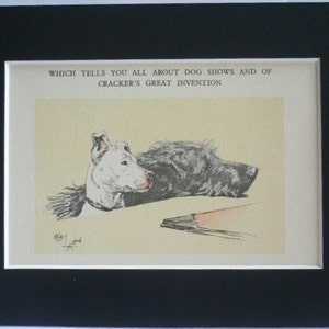 May include: An antique print featuring a dog illustration, set within a white mat and a black frame. The artwork depicts a dog with a white head and a dark body, accompanied by text that reads "WHICH TELLS YOU ALL ABOUT DOG SHOWS AND OF CRACKER'S GREAT INVENTION."