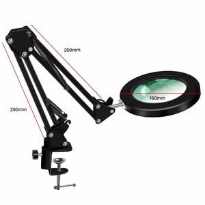 May include: A black magnifying lamp with an adjustable swing arm and a circular lens. The device features a clamp base for mounting. Technical labels indicate dimensions of 250mm and 260mm for the arm segments and 160mm for the lens diameter.