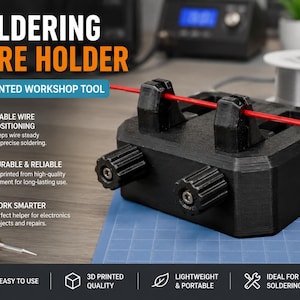 May include: A black 3D printed soldering wire holder featuring two adjustable knobs and a central channel for wire positioning. The device is labeled with the text SOLDERING WIRE HOLDER and 3D PRINTED WORKSHOP TOOL, highlighting its function for electronics projects.