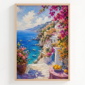 May include: An oil painting depicting a coastal Mediterranean town with white buildings, vibrant pink bougainvillea, and yellow flowers. A round table with a bowl of yellow lemons sits in the foreground, overlooking a deep blue sea with boats.