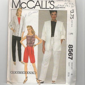 May include: A sewing pattern for a white jacket and trousers, and a red and white striped top and red shorts. The pattern is from McCall's and is for a size 8, bust 31 1/2 inches. The pattern is called "8567".
