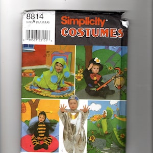 May include: Simplicity Costumes pattern 8814, size A (1/2, 1, 2, 3, 4). The envelope features illustrations of children wearing various costumes: a green dog, a clown, a bee, a silver space suit, and a green dragon with orange flames.