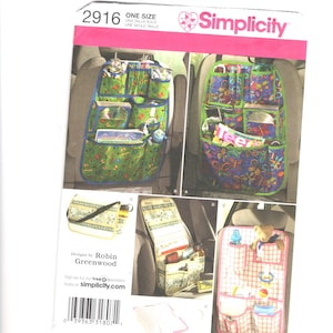 May include: A Simplicity 2916 sewing pattern envelope for car seat organizers. The front displays four variations of organizers with multiple pockets, featuring colorful butterfly, floral, and plaid patterns, along with text and a barcode.