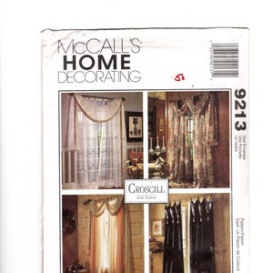 May include: A McCall's Home Decorating pattern featuring four different curtain designs. The pattern includes various styles, from sheer white curtains to patterned drapes, showcasing different valance and tie-back options. The pattern number is 9213.