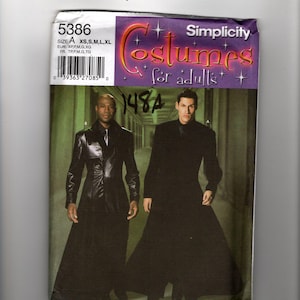 May include: A Simplicity sewing pattern envelope for adult costumes, number 5386, size A. The cover features two individuals wearing long, black, floor-length coats. One coat has a shiny, leather-like finish, while the other is a matte black fabric.