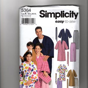 May include: A Simplicity 5364 easy-to-sew pattern envelope featuring illustrations of robes and trousers. The cover displays a group wearing various robes, including a floral print, a pink plaid, and a solid navy blue robe, with technical sketches.