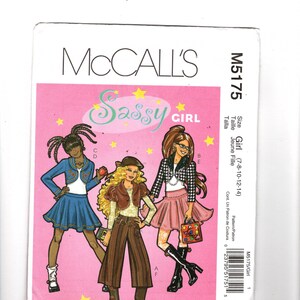 May include: A McCall's M5175 sewing pattern envelope for girls' clothing. The pink cover features illustrations of three outfits: a blue jacket and skirt, a brown cropped jacket with striped pants, and a black and white jacket with a pink skirt.
