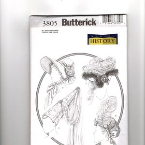 May include: Butterick sewing pattern 3805 Making History featuring illustrations of four headwear styles labeled A, B, C, and D. The designs include a bonnet with flowers, a tall headpiece with a veil, and two hats adorned with large feathers.