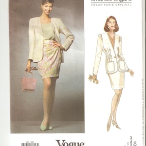 May include: A vintage sewing pattern for a women's suit by Emanuel Ungaro. The pattern is for a white jacket with a white skirt and a white blouse. The pattern is from Vogue Patterns and is size 14.