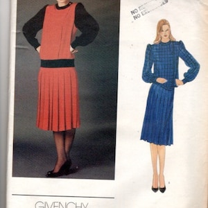 May include: A vintage Vogue sewing pattern for a dress with a pleated skirt. The pattern is for size 2637 and is by Givenchy.