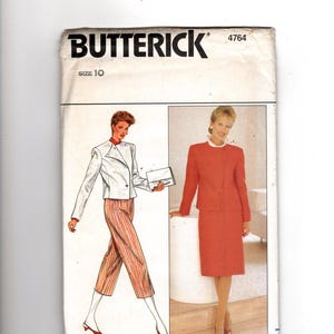 May include: A Butterick 4764 sewing pattern envelope for size 10. The front features illustrations of a white jacket with red striped cropped trousers and a solid red skirt suit. The text includes the brand name Butterick and the pattern number 4764.