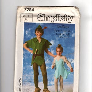 May include: A Simplicity sewing pattern envelope 7784 for Walt Disney's Peter Pan and Tinkerbell costumes. The cover features a photograph of two children wearing green and light blue costumes against a blue background with white star graphics.