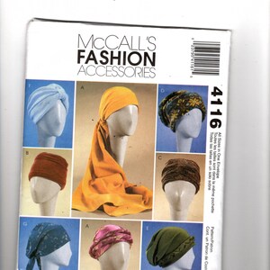 May include: A McCall's Fashion Accessories 4116 sewing pattern envelope featuring illustrations of various head coverings on mannequin heads. The designs include a light blue turban, a long yellow head wrap, a patterned fleece hat, and other styles.