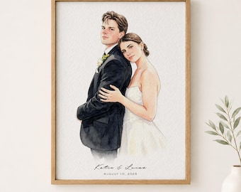 May include: A watercolour portrait in a wooden frame depicting a person in a black suit standing behind another person in a white wedding dress. The text below reads Katie & Lucas August 10, 2025. The artwork features soft brushstrokes and muted tones.