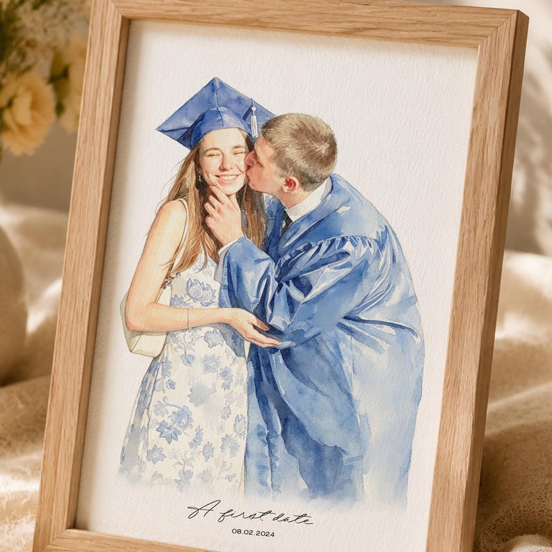 May include: A watercolour illustration in a light wood frame depicting a person in a blue graduation cap and gown kissing another person wearing a white floral dress. The text A first date and the date 08.02.2024 are printed at the bottom.