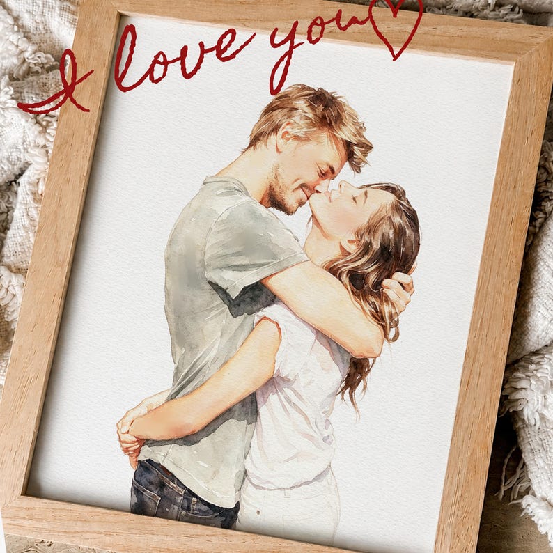 May include: A framed watercolour illustration of two people embracing and leaning in towards each other. The person on the left wears a grey t-shirt and dark jeans, while the person on the right wears a white top. The text I love you is written in red.
