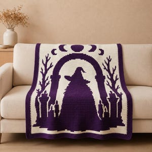 May include: A rectangular crochet blanket featuring a deep purple and cream color scheme. The design displays a central silhouette of a figure wearing a pointed hat standing under an archway, flanked by bare trees, candles, and a moon phase motif.