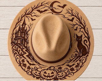 May include: A tan felt hat featuring a dark brown laser-engraved design of a haunted house, a crescent moon, bats, a cat, and jack-o'-lanterns. The brim displays intricate tree branches and foliage. Text at the bottom reads: SVG • PNG • Hand Burning PDFs.