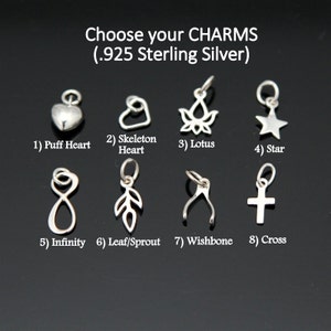 May include: A selection of .925 sterling silver charms, including a puff heart, skeleton heart, lotus flower, star, infinity symbol, leaf/sprout, wishbone, and cross. The text "Choose your CHARMS" is at the top.