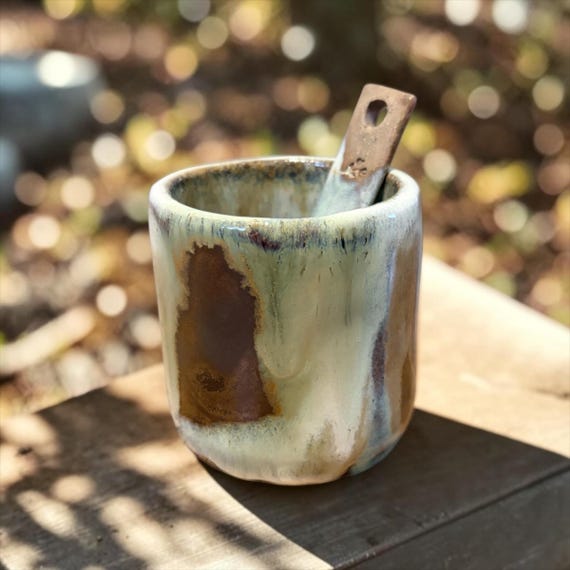 A hand-pinched stoneware salt cellar with its own tiny spoon — the kind of quietly beautiful, tactile kitchen object that makes cooking feel more intentional.