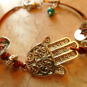 Natural dye Brown leather with Hamsa charm and decorative silver tone buttons.  #B00214