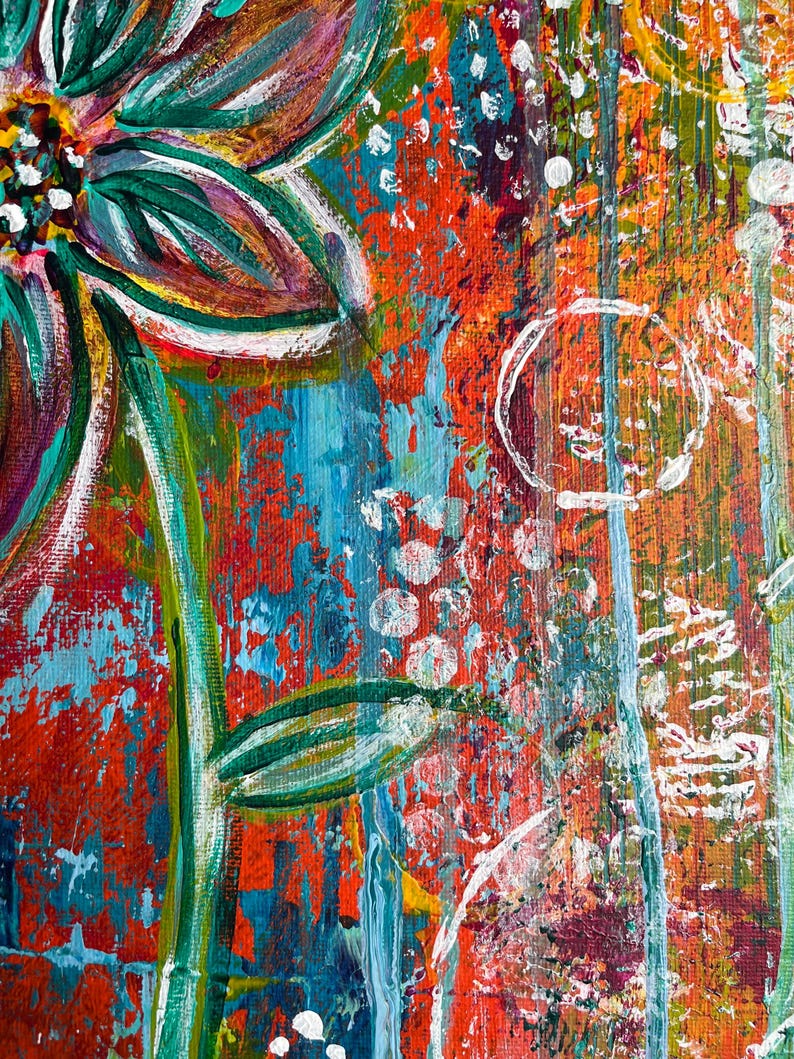 May include: An abstract acrylic painting featuring a large, stylized flower with teal and dark green petals. The background is a vibrant, textured mix of orange, red, and blue paint with white circular stamps and vertical drips of paint.