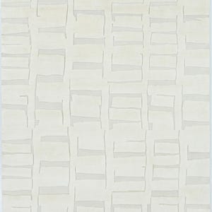May include: A rectangular area rug in a solid off-white colour featuring a repeating geometric pattern of raised, textured rectangular blocks arranged in a grid-like formation, creating a subtle depth and dimension across the entire surface.