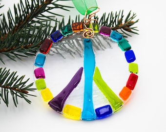 Fused Glass Peace sign ornament in a rainbow of colors with a custom-made copper hook it makes a great Christmas ornament or Christmas gift.