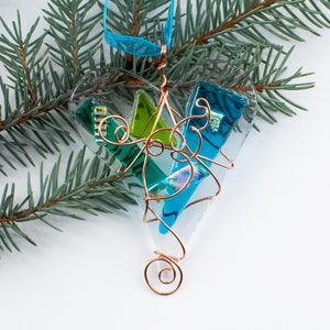 Fused Glass Heart in shades of turquoise and green with splashes of dichroic glass wrapped in copper wire makes a great Christmas ornament.