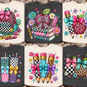 May include: A collection of six sweatshirts featuring colorful graphic prints of school supplies, including backpacks, apples, pencils, scissors, and tumblers. The designs incorporate leopard print, polka dots, checkered patterns, and bows.